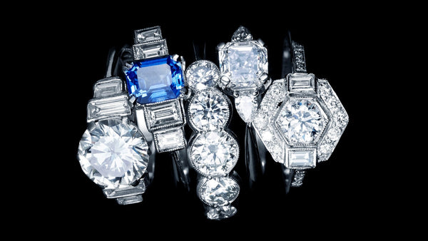 Art Deco style Diamond rings with Baguette Diamonds and geometric settings, one set with a Sapphire